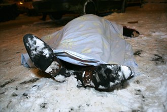 Moscow, russia, february 5, 2009, body of former deputy mayor of grozny gilani shepiyev, gunned down at the entrance to his home in western moscow, seen at the site of the murder.