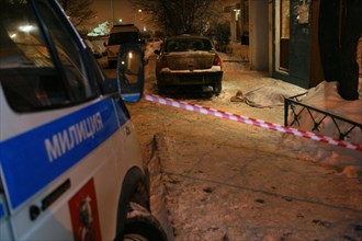 Moscow, russia, february 5, 2009, investigators work at the site where former deputy mayor of grozny gilani shepiyev was gunned down.