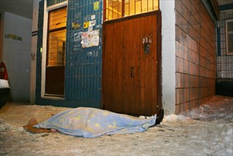 Moscow, russia, february 5, 2009, body of former deputy mayor of grozny gilani shepiyev, gunned down at the entrance to his home in western moscow, seen at the site of the murder.