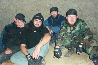 Moscow, russia, july 26, 2002, khattab's right-hand man isayev, aka the 'elsi the red', achimez gochiyayev, khattab and his bodyguard (r-l) seen in the photo made public by the federal secirity servic...