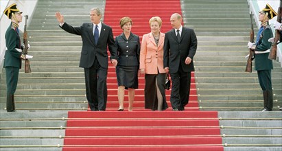 George bush, laura bush, lyudmila putina and vladimir putin (all l-r) pictured leaving the grand kremlin palace after an official launch to have a stroll in the kremlin, on friday, may 24, 2002.