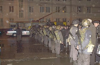 Moscow, russia, october 24, 2002, squads of special troops pictured cordoning off the area near the palace of culture seized by terrorists on wednesday evening, people, who had come to watch the music...