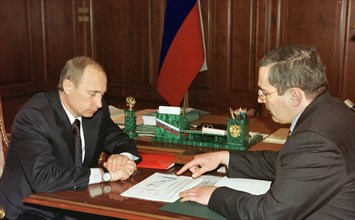 President vladimir putin (l) pictured during the meeting with board chairman of the yukos oil company mikhail khodorkovsky in the kremlin on friday, december 20, 2002.