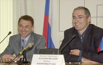 Moscow, russia, june 18, 2003, new chairman of the directors ' board of the yukos oil company semen kukes (l) and chairman of the directors' board of the yukos- moscow company mikhail khodorkovsky pic...