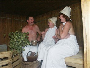 A man and two women in a sauna (banya) of the sanatorium 'slavino', one of the best of its kind in the area, the sanatorium was built by west-siberian steel works for those employed by the enterprises...