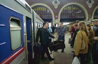Moscow, russia, august 28, 2003, arriving passengers at kazansky railway station, additional trains were introduced to offset the seasonal flood of passengers, kursky and kazansky railway stations are...