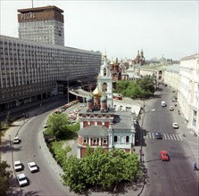Central part of zarjadie-varvarka street, moscow, russia, hotel 'russia' ('rossiya') on the left, in the foreground, george church on the pskov hill (17th century).