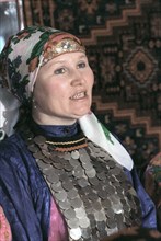 Udmurtia, siberia, russia, 2/93, a peasant resident of the udmurt village of zavyalova wearing udmart national costume.