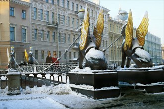 Winged beast statues adorn bank bridge over griboedova canal, st, petersburg, russia.