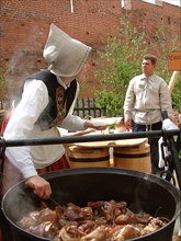 Cooking traditional latvian food at a folk festival in riga, latvia, 2003.