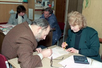 Russian tax payer with a federal tax inspector, moscow, russia, march 2002.