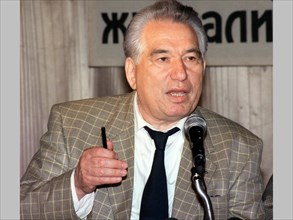 The prominent kirghiz writer chinghiz aitmatov speaking at festive party '500 days till the year 2000' was held at the russkiye gvozdi (russian hits) club in moscow, 1998, the organizers, members of t...