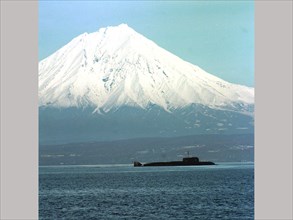 A pacific fleet's nuclear submarine of the granit class shown in the avachinsky harbour (russia's far east), the koryaksky volcano is in the background, kamchatka,russia,may 1, 1999.