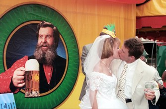 The newly weds fail the tradition and mark their wedding with beer instead of champagne at the grand moscow beer festival opened here today for the first time in luzhniki sports complex, moscow, russi...