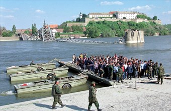 Belgrade, yugoslavia, april 20,1999, the military servicemen organized a ferry-boat/ops/ instead of warandinsky bridge over dunai river destroyed by nato air-raids.