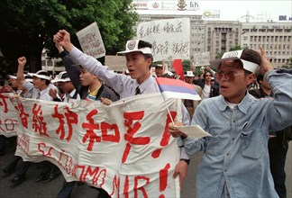 Belgrade,yugoslavia, may 9 2001, in response to the bombing of the chinese embassy in belgrade, about 200 young chinese rally in downtown belgrade on sunday demanding to end the nato`s bombing of yugo...
