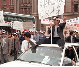 Belgrade,yugoslavia, may 9 2001, in response to the bombing of the chinese embassy in belgrade, about 200 young chinese rally in downtown belgrade on sunday demanding to end the nato`s bombing of yugo...