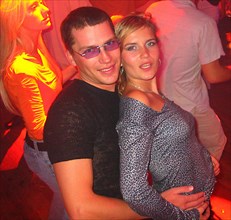 Young latvian couple at nautilus a popular night club in riga's old city, latvia, 2003.
