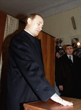 Russian prime minister vladimir putin seen casting his vote during the elections to the state duma, at the polling station #2026 in moscow's kosygina street,moscow, russia, december 19, 1999.