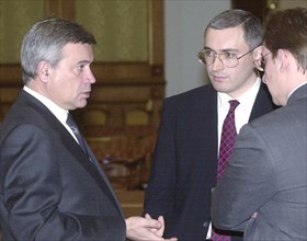 Lukoil chief vagit alikperov, left, and yukos board chairman mikhail khodorkovsky, center, attending a special conference chaired by russian premier mikhail kasyanov in moscow on wednesday, the situat...