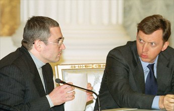 Moscow, russia, january 24 2001: mikhail khodorkovsky, chairman of yukos oil company directorate (left) and oleg deripaska, general director of 'russian aluminium' company, exchanging looks during the...