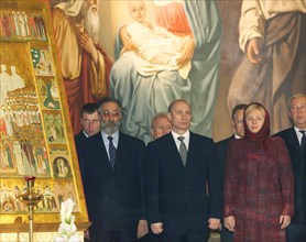 Russian president vladimir putin, his wife lyudmila, and state duma vice-speaker artur chilingarov attending the overnight easter mass at the christ the saviour cathedral on the night from saturday to...
