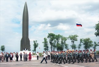 Astrakhan region, russia, may 14 2001: military brass orchestra marching in front of a combat missile r-1