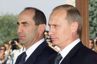 Yerevan, armenia, september 14, 2001, russian president vladimir putin (r) and his armenian counterpart robert kocharyan pictured during an official welcoming ceremony upon the arrival of russian head...