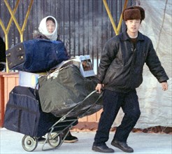 Chinese vendors in the city of nakhodka, far east, russia, 2001.