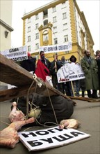 Moscow, russia, march 22 2002: participants of a rally in front of the american embassy protesting import of chicken leg quarters from the u,s,a, about a dozen youngsters took part in the rally, the p...