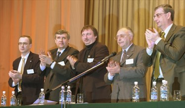 Moscow, russia, march 30, 2002: participant in the all-russian political movement 'liberal russia' (l to r): pavel arsenyev, co-chairman of the movement sergei yushenkov, chairman of the executive com...