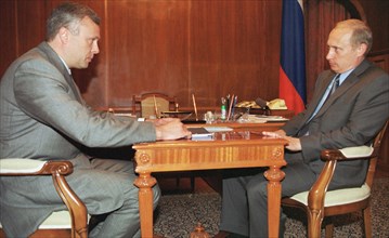 Head of the national reserve bank, alexander lebedev meeting with vladimir putin, may 7, 2002.