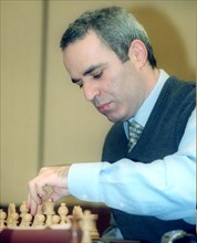 Chess grandmaster garry kasparov playing at the second round of the fide grand prix held in the international trade center early in june 2002.