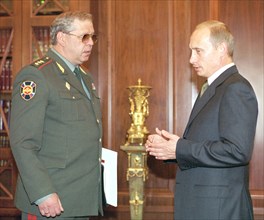 President vladimir putin (r) and director of the russian federal borderguard service konstantin totsky (l) during their meeting in the kremlin today,head of service reported president on the situation...