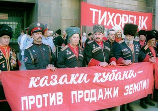 Moscow, russia, june 21 2002: some cossacks from the kuban area took part in the meeting the banner reads 'cossacks are against sale of land!', communists staged a meeting in front of the state duma t...