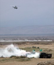Caspian war game episode, dagestan, russia, august 11, helicopters attacking simulated enemy positions (in pic), an episode of war game within the framework of the exercises of the caspian flotilla.