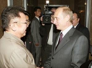 President vladimir putin (r) bids farewell to north korean leader kim jong-il in vladivostok on friday, the korean leader has ended his visit to the city today, 23,08,2002     .