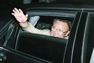 North korean leader kim jong-il waves his hand prior to the departure from vladivostok, russia, on friday, 8/23/02  .