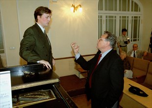 Famous russian opera singer vladimir atlantov (right) teaching danlll sokolov, third year student at the st, petersburg conservatory, st,petersburg, russia, september 12 2002.