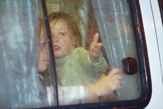 Moscow, russia, 10/23/02: some children (seen in a bus) were allowed to leave the building of the palace of culture of the ball-bearing plant which had been seized by terrorists, on wednesday, accordi...