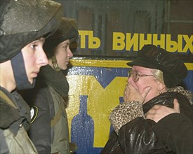 Moscow, russia, 10/24/02: a relative of one of the hostages held  by terrorists in the palace of culture pictured in tears in front of a cordon of special police troops, on thursday night , omon and s...