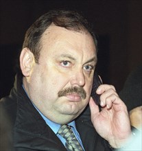 Moscow, russia, october 25, 2002: a member of the state duma's security committee gennady gudkov speaks over the telephone outside the dubrovka theatrical center where hostages are held by chechen ter...