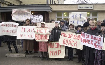 Moscow, russia, october 25 2002: relatives of those taken hostage by a group of terrorists in the building of the palace of culture of the ball-bearing plant pictured picketing with slogans to stop th...