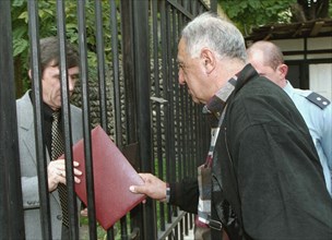 Tbilisi, georgia, october 25 2002: a representative of the georgian political movement 'ertoba' (unity) pictured handing a statement to an official of the russian embassy here on friday , the statemen...