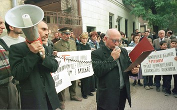 Tbilisi, georgia, october 25, 2002: a member of the political council of the 'ertoba' (unity) movement shota kvirtiya reading a statement in support of the leadership and the people of russia , the st...