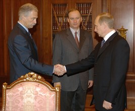 Moscow, russia,10/26/02: chechen hostage crisis: president vladimir putin (r) had a working meeting with federal security service chief nikolai patrushev (c) and interior minister boris gryzlov (l), t...