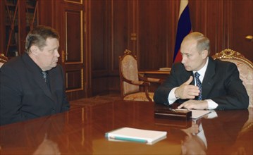 Moscow, russia,10/26/02: chechen hostage crisis: president vladimir putin (r) had a meeting with prosecutor general vladimir ustinov (l) who reported that all the matters related to the crime will be ...