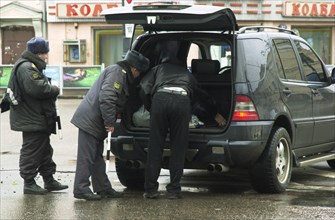 Moscow, russia,10/26/02, chechen hostage crisis: law enforcement personnel examine a car in search for the terrorists who managed to escape from the theatre were they held hostages.