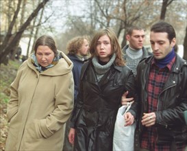 Moscow, russia, october 28 2002: relatives accompanllng one of the freed hostages (centre), discharge from the moscow's hospital n13 on monday.