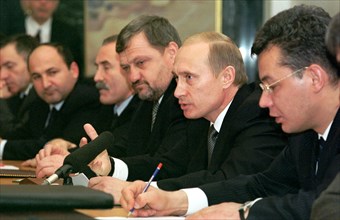 Moscow, russia, november 10 2002: right to left: special representative of the president of russia for ensuring human rights in chechnya abdul-khakim sultygov, president of russia vladimir putin, head...